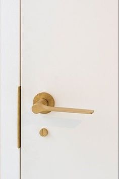 an open door with a wooden handle on it