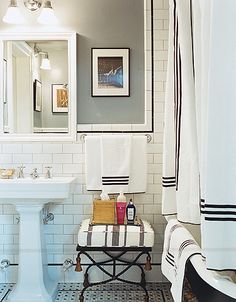 a white bathroom with black and white decor