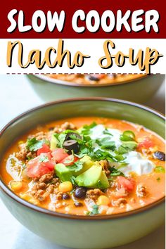 a bowl of slow cooker nacho soup with avocado and sour cream