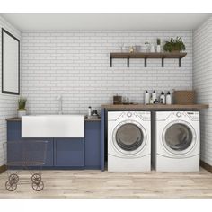 a laundry room with washer and dryer in front of a brick wall that has shelves above it