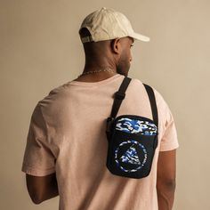 Elevate your everyday carry with the Sobriety Camo Crossbody Bag. Designed to complement our popular Sobriety Camo Unisex Tee, this versatile bag features the same bold blue, black, and white camouflage pattern with the empowering sobriety symbol at its center. Perfect for those in recovery or anyone embracing a sober lifestyle, this bag is both a statement piece and a practical accessory. With ample storage for your essentials, durable construction, and an adjustable strap for comfort, the Sobr Blue Bags With Adjustable Strap For Streetwear, Blue Adjustable Strap Bag For Streetwear, Blue Streetwear Bag With Adjustable Strap, Urban Blue Bags For Everyday Use, Embroidered Hats, Embroidered Hoodie, Zip Up Hoodies, Embroidered Tshirt, Everyday Carry