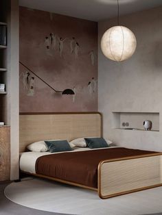 a bedroom with a bed, nightstands and paintings on the wall behind it in shades of brown