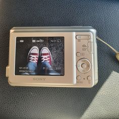 an electronic device with a pair of shoes on it