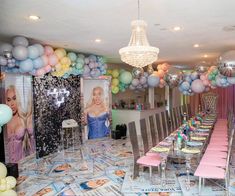 a party room with balloons and pictures on the wall, tables set up for an event