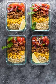 four glass containers filled with rice, meat and veggies on top of a table