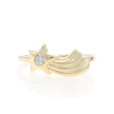 a yellow gold ring with a diamond in the middle and a star on it's side