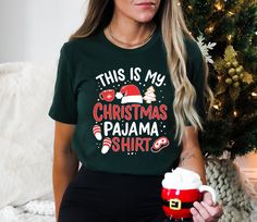 This is My Christmas Pajama Shirt, Gift for Christmas, Christmas Party Shirt, Funny Christmas Shirt, Pajama Shirt **DISCRIPTION** 📝 1. Personalization box is only for design color information. 🎨    2. This design will be made with DTG printing. 🖨️  3. Backside design is additional fee, please make sure to add the fee into your purchase. 💰 4. If you want to add or change anything on the existing design that we show in the display picture, please contact with the seller from message box to ask if the changes and additional request can be done or not, if you do not ask and request for it without asking in the order we will ship the item as it is without the requests done. ❓ 5. Please check the color charts for the size and type of the tshirt you want, not every color is available for each Christmas Party Shirt, Christmas Party Shirts, New Years Shirts, Display Picture, Funny Christmas Shirts, Message Box, Xmas Party, Dtg Printing, Gift For Christmas