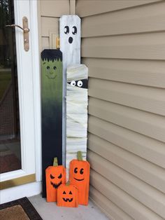 halloween decorations made to look like pumpkins and ghost faces