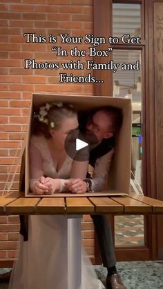 a man and woman sitting in a cardboard box with the words, this is your sign to get'i'm the box photos with family and friends