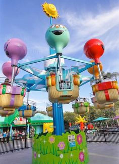 an amusement park ride with colorful rides