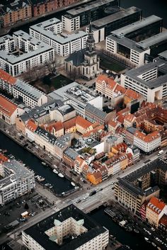 an aerial view of some buildings and water