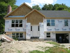 a house under construction with the roof up