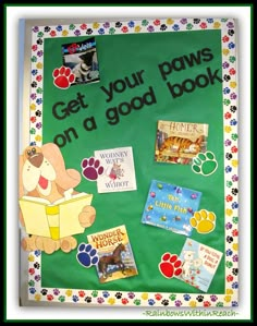 a bulletin board with dog books and paw prints