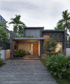 a modern house in the middle of a tropical garden