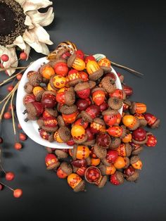 a white bowl filled with lots of different types of fruit on top of a table