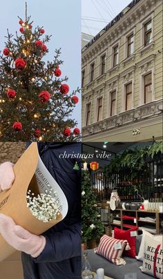 a christmas tree with red balls in the middle and a man holding a box full of popcorn