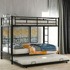 a black metal bunk bed sitting on top of a hard wood floor next to a window