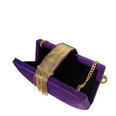 Purple is the epitome of royalty and gives you the power to transform the most modest outfits into a luxurious one. Simitri’s signature handcrafted mixed metallic tassels add just the right finishing touches, making our Plum Fringe clutch fit for the Queen’s Ball. Composition Purple art silk clutch with a metallic chain strap belt closure Lush black velvet interior lining giving it the luxury it deserves Magnetic closure on top to make it convenient to open and close Size 8"W x 6"H x 2.5"D 20.5" Formal Purple Clutch Shoulder Bag, Luxury Purple Clutch For Evening, Chic Purple Pouch Clutch, Trendy Purple Rectangular Clutch, Elegant Purple Rectangular Clutch, Fringe Clutch, Gossip Girl Reboot, Silk Clutch, Velvet Interior