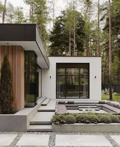 a modern house in the middle of a forest