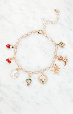 Bring a sweet touch to your look with the LA Hearts Strawberry Charm Bracelet. This bracelet is complete with a gold finish, an adjustable closure, and cute little charms.Gold chain designAdjustable lobster clasp closureCharm details LA Hearts Womens Strawberry Charm Bracelet - Gold Cute Adjustable Gold Charm Bracelet, Cute Gold Bracelets With Charms, Strawberry Bracelet, Bracelets Aesthetic, Strawberry Charm, Gold Chain Design, Gold Charm Bracelet, Cute Bracelets, Jewelry Inspo