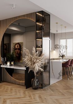 an image of a living room with furniture and decor on the walls, including a large mirror