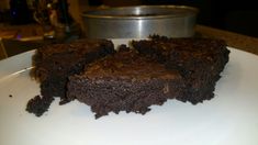 two pieces of chocolate cake on a white plate