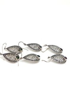 "Intricately detailed sterling silver Bali teardrop earrings with a pear-shaped semi-precious stone at the bottom measures 1 3/4\" in length from the top of the ear wire and 5/8\" in width at its widest point. The pear-shaped stone measures 1/8\" in width and 3/16\" in length. Earrings are rhodium plated over sterling silver so as to prevent tarnishing." Sterling Silver Intricate Teardrop Earrings, Sterling Silver Teardrop Earrings With Intricate Design, Sterling Silver Filigree Teardrop Earrings, Handmade Ornate Teardrop Earrings, Ornate Sterling Silver Teardrop Earrings, Silver Oval Teardrop Pierced Earrings, Bali Earrings, Filigree Earrings, Citrine Stone