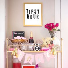 a happy hour sign is hanging above a bar cart filled with drinks and condiments