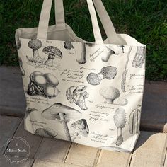 a tote bag with mushrooms all over it