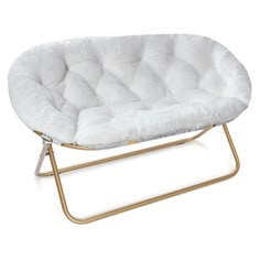 a white chair sitting on top of a metal frame with a fur covered seat cushion