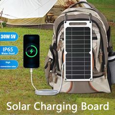 the solar charging board is attached to a backpack