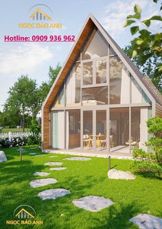 an image of a house that is in the middle of some grass with stepping stones on it