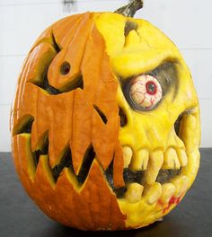 a carved pumpkin with an evil face on it