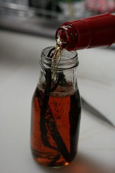 a jar filled with liquid sitting on top of a table