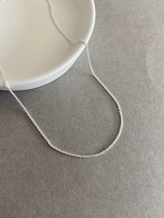 "Sterling Silver \"Rolo Chain\" Necklace Chain ★ Color : Silver ★ Material : Sterling Silver ★ Type : Rolo Chain ★ Chain Thickness : 1mm(040) / 2mm(060) ★ Chain Length : 16 inches / 18 inches / 20 inches ★ Comes in a jewelry box." Delicate Rolo Chain Necklace, Dainty Rolo Chain Link Necklace, Delicate Sterling Silver Cable Chain Necklace, Delicate Silver Chain Necklace For Everyday, Minimalist Necklace With Rolo Chain Link, Minimalist Necklace With Rolo Chain And Round Pendant, Minimalist Necklace With Rolo Chain, Simple Silver Delicate Chain Necklace, Minimalist Oval Link Rolo Chain Necklace