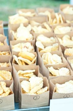 several boxes filled with chips sitting on top of a table