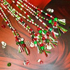 several candy canes and christmas decorations on a red tablecloth with other holiday items