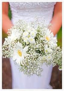 a woman holding a bouquet of daisies on her wedding day, with the caption pinter