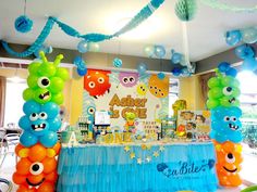 an assortment of balloons and decorations at a birthday party