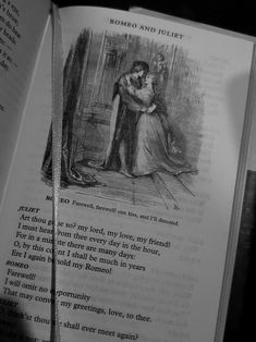 an open book with a drawing of a man hugging a woman