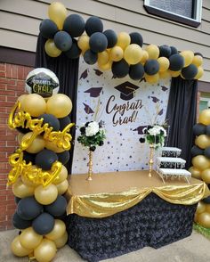 a graduation party with balloons and decorations