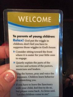 a person holding up a card that says welcome to parents of young children