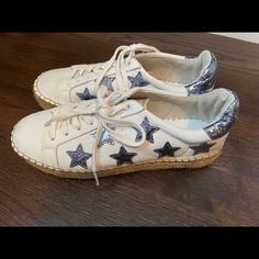 White Sneaker/Espadrille With Sparkly Stars. Have Only Been Worn Once And Look Brand New! These Sneakers Are Very Comfortable And Look Amazing With Every Outfit! They Are Trendy And Are So Cute! They Go With Every Outfit Since They Are White, And They Have A Pop Of Color With The Silver/Blue Stars!!! Casual Low-top Espadrilles With Contrast Sole, Trendy Espadrilles With Rubber Sole, Trendy White Round Toe Espadrilles, Blue Stars, Trendy Sneakers, Marc Fisher, Blue Star, Silver Blue, White Sneaker