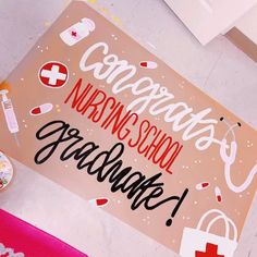 a sign that says congratulations nursing school graduate on the floor next to other medical supplies