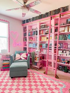 a room with pink walls and shelves filled with books