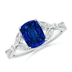 a blue sapphire and diamond ring on a white background