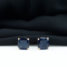 Product Details Adorn yourself in these Solitaire Stud Earrings embellished with a 7 MM Cushion Cut Created Blue Sapphire Solitaire which adds pop of color and enhances your ensemble. Product Information SKU SHP-EARRINGS042014458 Length 7 mm Width 7 mm Weight 1.28 gm LAB CREATED BLUE SAPPHIRE INFORMATION No.of Stones 2 Pieces Total Weight 5.50 Carat Dimension(approx) Cushion-8X8 mm-2 Pcs Color Blue Cut Brilliant cut Shape Cushion Setting Type Prong-Setting Quality Grade AAAA View More Sapphire Solitaire Jewelry With Cushion Cut, Cushion Cut Sapphire Jewelry For Formal Occasions, Classic Blue Cushion Cut Jewelry, Classic Cushion Cut Sapphire Jewelry, Elegant Blue Cushion Cut Earrings, Cleaning Stone, Sapphire Solitaire, Solitaire Studs, Signature Jewelry