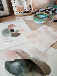 some watercolors are laying on the table and ready to be made into paintings