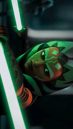 a cartoon character holding a green light saber