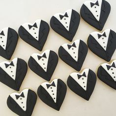 black and white decorated cookies in the shape of tuxedos